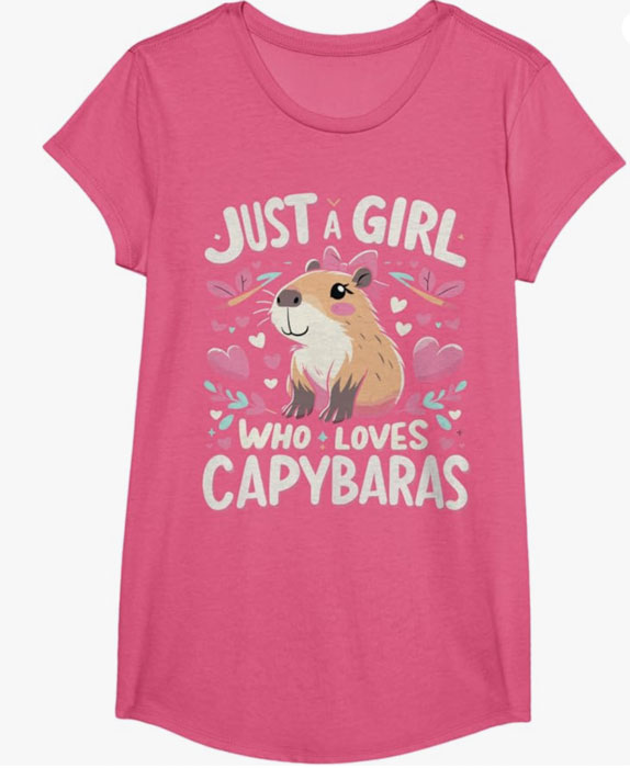 Pink capybara-themed girls’ t-shirt with “Just a Girl Who Loves Capybaras” text and cute illustrated capybara surrounded by hearts and flowers.