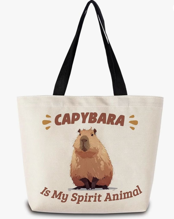 White capybara tote bag with black handles, featuring the phrase “Capybara is My Spirit Animal” and a cute illustrated capybara design.