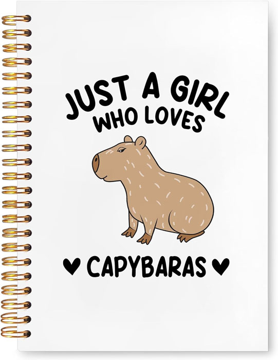 Hardcover spiral notebook with capybara illustration and text “Just a Girl Who Loves Capybaras”.